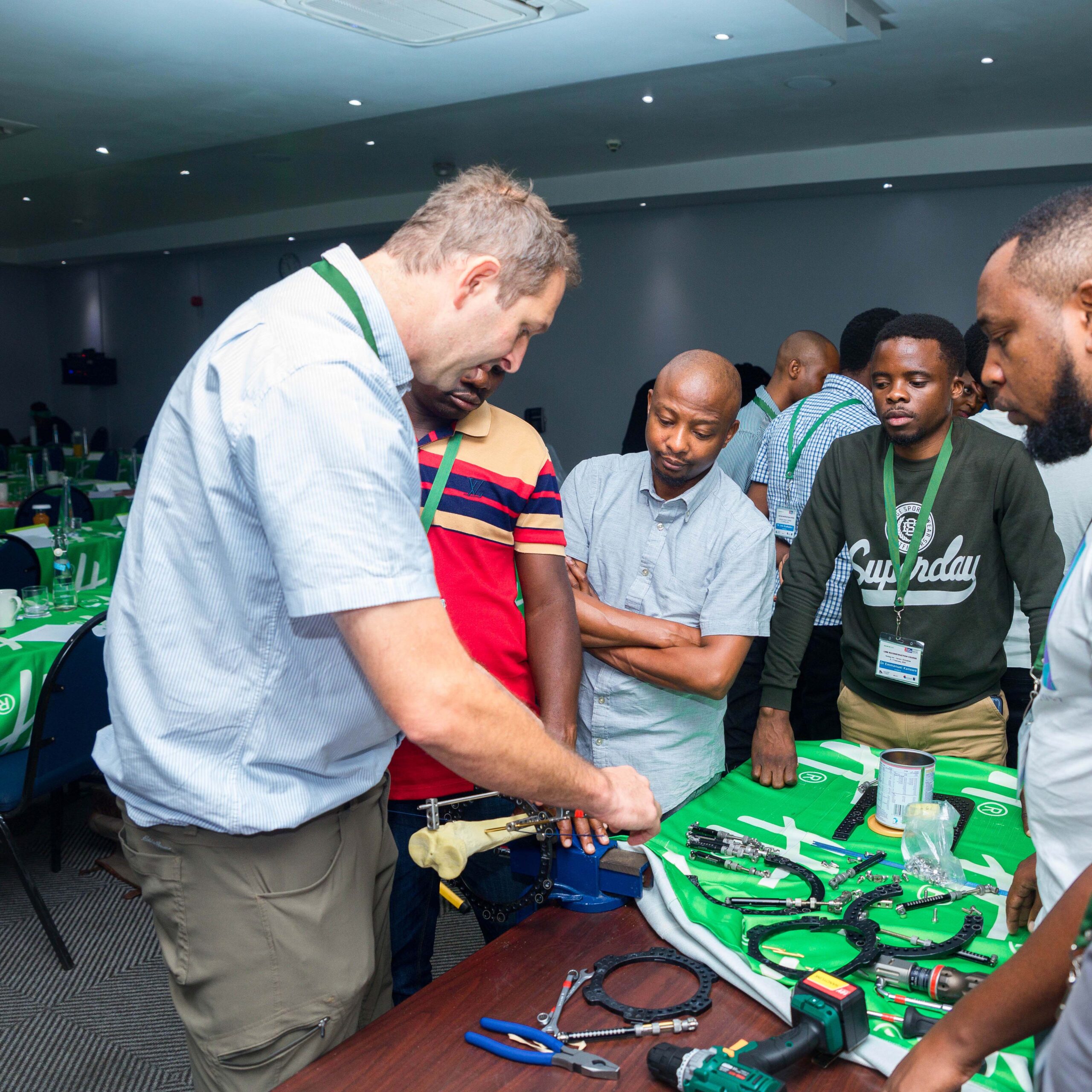 Dr. Sam instructs attendees on how to build an Ilizarov frame.