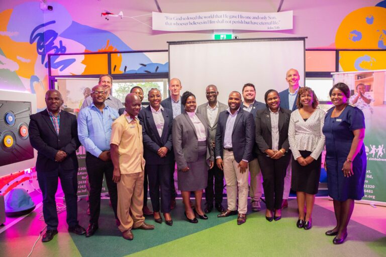 Members from Stanbic Bank pose for a photo alongside hospital staff in the CURE Zimbabwe Children’s Playroom.